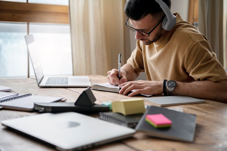 A freelance writer working on a laptop from home in 2025
